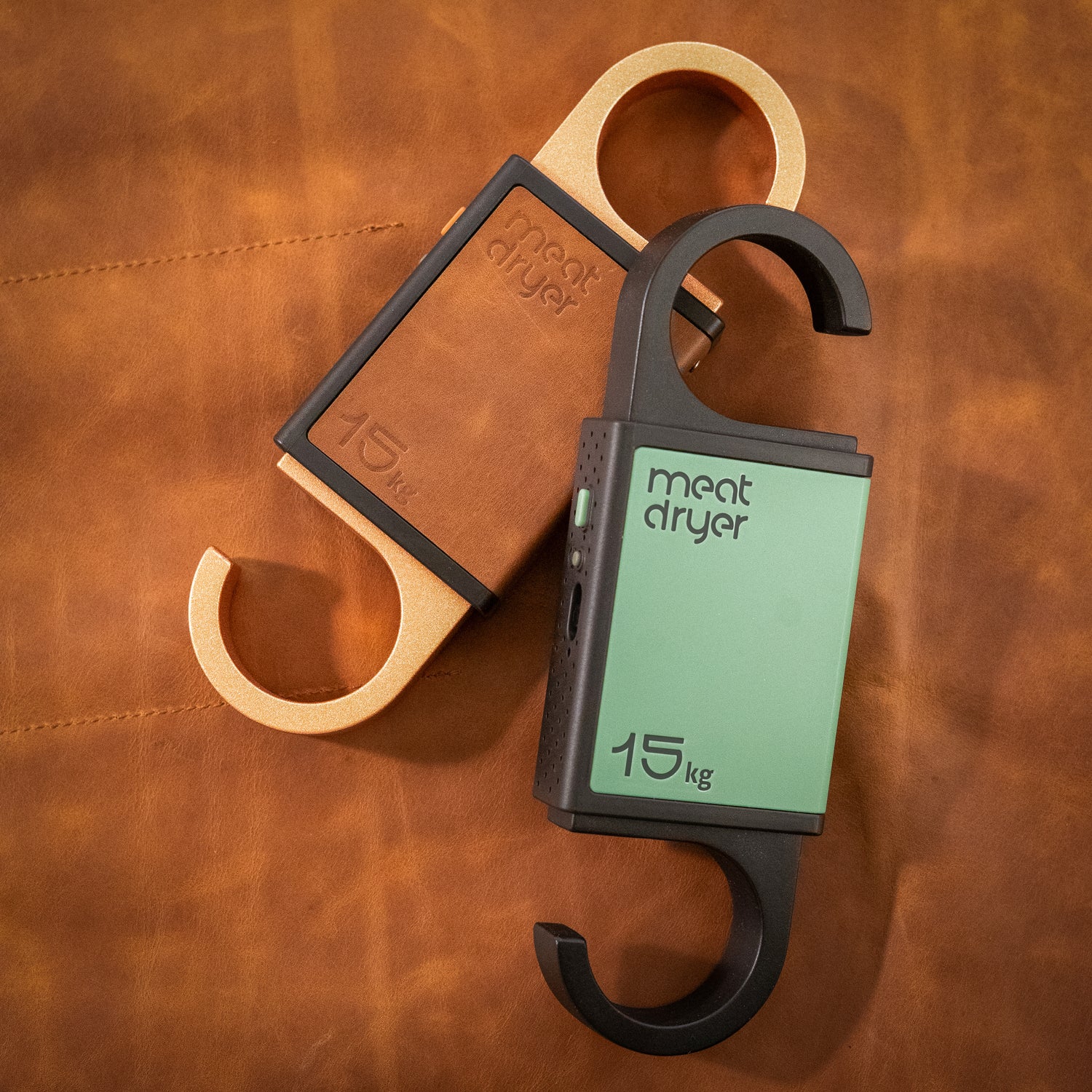 Meatdryer smart hooks with mobile app  on a brown leather background
